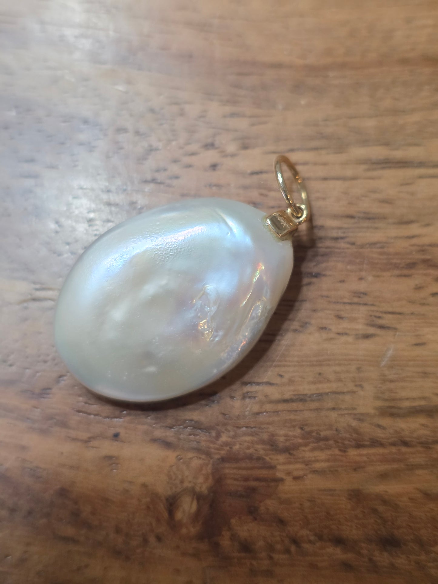 Bezel Set Emeralds on a Coin Pearl